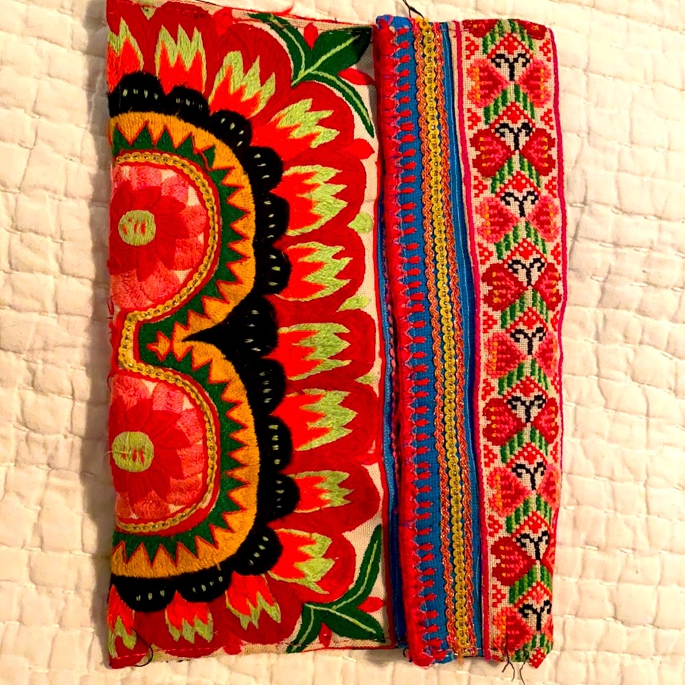 This is a embroidery clutch bag. Super cute with snap closure on each side.